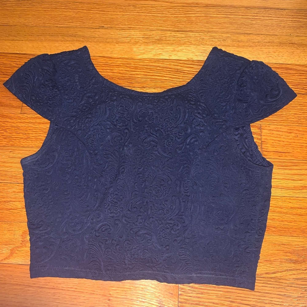 Navy blue crop top, with open back.